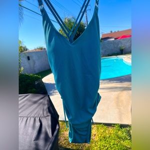 blue one piece bathing suit low open back with adjustable strings